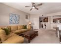 Bright living room with comfortable seating and an open layout flowing into other living spaces at 20801 N 90Th Pl # 255, Scottsdale, AZ 85255