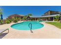 Community pool with blue water, clear skies, and nearby buildings for a relaxing outdoor experience at 20801 N 90Th Pl # 255, Scottsdale, AZ 85255