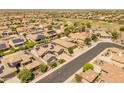 Community featuring tree lined streets and homes with solar panels at 26484 W Mohawk Ln, Buckeye, AZ 85396