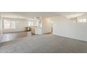 Open-concept living room with carpet and ample natural light at 3282 S Warner Dr, Apache Junction, AZ 85120