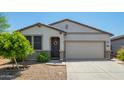 Charming single-story home featuring a two-car garage, neutral stucco, desert landscaping and a welcoming front door at 3715 S 57Th Ln, Phoenix, AZ 85043
