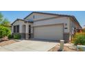 Charming single-story home featuring a two-car garage, neutral stucco, desert landscaping, and a welcoming front door at 3715 S 57Th Ln, Phoenix, AZ 85043