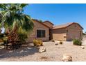 Nice single-story home with easy-care desert landscape design and a convenient two-car garage at 43581 W Mccord Dr, Maricopa, AZ 85138