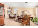 Cozy living room featuring tan walls, tile floors, and comfortable seating, creating a welcoming atmosphere at 5524 E Garnet Cir, Mesa, AZ 85206