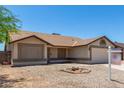 Inviting home exterior featuring desert landscaping, neutral tones, and a welcoming facade at 6317 E Colby St, Mesa, AZ 85205