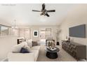 Stylishly staged living room featuring modern furnishings and a cozy atmosphere, perfect for relaxing and entertaining at 6317 E Colby St, Mesa, AZ 85205