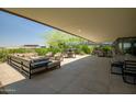 Expansive patio featuring outdoor seating, dining area, and lush greenery, ideal for relaxation at 7117 E Rancho Vista Dr # 6007, Scottsdale, AZ 85251