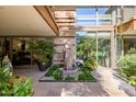 Relaxing courtyard with water feature and lush greenery at 7167 E Rancho Vista Dr # 3002, Scottsdale, AZ 85251