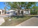 Single-Gathering home with fresh landscaping and a 'For Sale' sign on the front lawn at 10402 E Javelina Ave, Mesa, AZ 85209