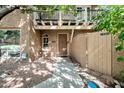 Home exterior with a small balcony, walkway, and desert landscaping at 10424 N 7Th Pl # 2, Phoenix, AZ 85020