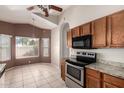 Eat-in kitchen features stainless steel appliances and granite countertops at 10923 W Ivory Ln, Avondale, AZ 85392