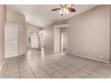 Spacious living room featuring tile floors, neutral walls, and archways at 10923 W Ivory Ln, Avondale, AZ 85392