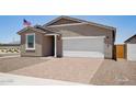 Inviting single-story home boasts an attached two-car garage, a paved driveway, and a low-maintenance yard at 18268 W La Senda Dr, Surprise, AZ 85387