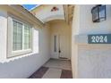 Close-up of the front entrance showcasing the door, window, and house number at 2024 W Darrel Rd, Phoenix, AZ 85041