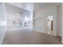 Spacious living room with a neutral color scheme, carpet flooring, and ample natural light at 2024 W Darrel Rd, Phoenix, AZ 85041