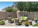 Relaxing backyard retreat with a grill, cozy seating area with mountain views, and well-maintained landscaping at 2301 E Sunnyside Dr, Phoenix, AZ 85028
