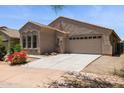Attractive home exterior showcases a two-car garage, low maintenance desert landscaping, and a private residence at 35314 N 31St Ave, Phoenix, AZ 85086