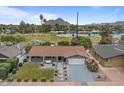 Aerial view showcasing the house, backyard, landscaping, and proximity to a large park and recreation area at 5332 N 81St Pl, Scottsdale, AZ 85250