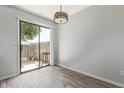 Light-filled dining area with sliding door access to a private outdoor space at 5704 E Aire Libre Ave # 1093, Scottsdale, AZ 85254
