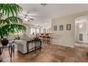 Inviting living room with tile flooring, neutral walls, and comfortable seating at 6418 S Pinaleno Pl, Chandler, AZ 85249