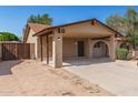 Charming single-story home with a convenient carport and low-maintenance landscaping at 7340 W Meadowbrook Ave, Phoenix, AZ 85033