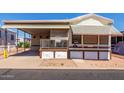 Welcoming single-story home with covered parking, and well-kept landscaping at 7750 E Broadway Rd # 357, Mesa, AZ 85208