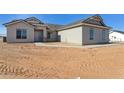 New construction home showcasing a neutral color scheme and simple landscaping at 11215 E Crescent Ave, Mesa, AZ 85208