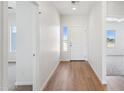 Inviting foyer with wood-look flooring, natural light, and neutral paint at 11227 E Crescent Ave, Mesa, AZ 85208