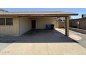 Attached carport with concrete flooring providing ample parking and some storage space at 11849 N 29Th Ave, Phoenix, AZ 85029