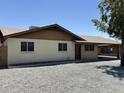 This single-story home features a carport and low-maintenance desert landscaping at 11849 N 29Th Ave, Phoenix, AZ 85029