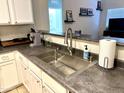 Kitchen with stainless steel sink and faucet, open to dining area at 1350 S Greenfield Rd # 2231, Mesa, AZ 85206