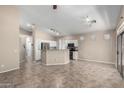 Open-concept living area features tile flooring, neutral walls and plenty of space for entertaining and relaxation at 14314 W Lexington Ave, Goodyear, AZ 85395