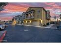 Townhome complex with garage and balcony with desert landscaping and parking at 17150 N 23Rd St # 125, Phoenix, AZ 85022