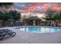Relaxing community pool with lounge chairs and a shaded gazebo at 17150 N 23Rd St # 125, Phoenix, AZ 85022