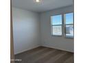 Bright bedroom with neutral carpet, dual windows and a view of the desert at 18269 W Camino De Oro --, Surprise, AZ 85387