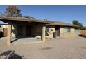 Inviting single-Gathering home featuring a covered porch and xeriscaped landscaping at 1841 N Wilbur Cir, Mesa, AZ 85201