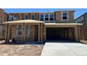 View of a home under construction, showing exterior framing with WaterBlock sheathing and a concrete driveway at 27279 N 73Rd Ln, Peoria, AZ 85383