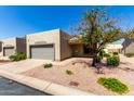 Inviting single-level home with an attached garage and desert landscaping for easy care at 64 N 63Rd St # 25, Mesa, AZ 85205