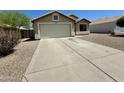 A single-story home featuring a driveway, well-kept landscaping, and an attached garage at 740 W Dublin St, Gilbert, AZ 85233