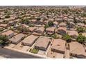 Aerial view of a home in a quiet community. Landscaping, backyard privacy, and community feel at 9329 E Olla Ave, Mesa, AZ 85212