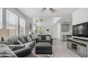 Bright living room with large windows, comfortable seating, and stylish decor, creating a cozy atmosphere at 14870 W Encanto Blvd # 1059, Goodyear, AZ 85395