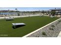 Outdoor game area featuring cornhole boards for recreational fun and neighborhood events at 15505 W Corte Del Sol Este --, Waddell, AZ 85355