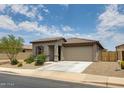 Charming single-story home featuring a well-maintained front yard with desert landscaping and an attached garage at 1630 E Prickly Pear Pl, Casa Grande, AZ 85122