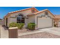 Charming single-story home with a two-car garage and well-maintained landscaping at 16827 S 20Th Way, Phoenix, AZ 85048