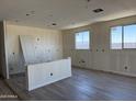 Spacious living room with tile floors, natural light, and modern design at 18272 W Camino De Oro --, Surprise, AZ 85387