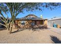 Quaint brick home with desert landscaping, showcasing its charming facade and inviting appeal at 1950 W Palm Ln, Phoenix, AZ 85009