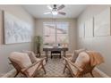 Stylish home office with modern desk, neutral decor, and plenty of natural light at 20641 W College Dr, Buckeye, AZ 85396