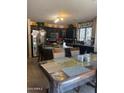 Spacious kitchen with granite counters, stainless appliances and a breakfast bar at 23890 W Twilight Trl, Buckeye, AZ 85326
