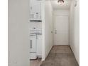 View of a white hallway leading to the front door at 3208 W Port Royale Ln, Phoenix, AZ 85053