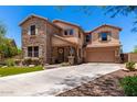 Charming two-story home featuring stone accents, a covered porch and a two car garage at 3760 W Lapenna Dr, New River, AZ 85087
